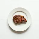 Rind, Entrecôte, "medium" gebraten (ohne Zusatz von Fett und Salz)