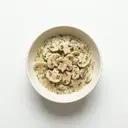 Champignons gedünstet, in Kräutersauce von heller/weißer Grundsauce