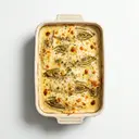 Chicoree gedünstet, mit Käsesauce von Bechamelsauce gratiniert