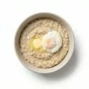 Haferflockenbrei gesüßt, mit Butter und Ei