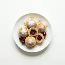 Kirschknödel mit Zucker und Zimt