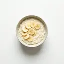 Milchreis mit Milch 3,5 % Fett und Banane roh