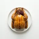 Pute mit Kastanienfüllung, gebraten im Ofen, mit Preiselbeerkonfitüre und Grundsauce dunkel/braun