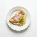 Schaumomelett gesüßt, gebraten, mit Zitronensaft beträufelt