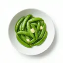 Zuckererbsen gekocht, in Butter geschwenkt