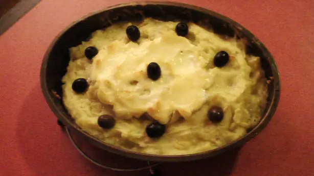 Foto von Portugiesischer Bacalhau à Zé do Pipo – fertig angerichtet