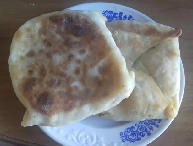 Foto von Uzbekischer Bichak mit Kürbisfüllung – fertig angerichtet